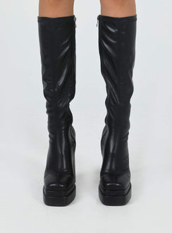 Knee high boots Faux leather material Platform base Rounded toe Zip fastening at side Block heel Padded footbed