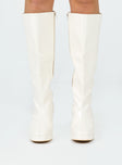 Cream knee high boots Faux glossy leather  Zip fastening at side  Block heel  Rounded toe 