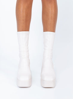 Boots  Faux leather material  Fitted at leg  Block heel  Platform base  Square toe  Slight stretch 