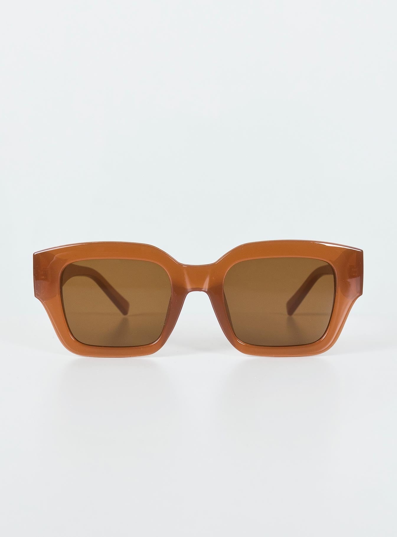 Brown sunglasses Oversized frame  Brown tinted lenses Moulded nose bridge  
