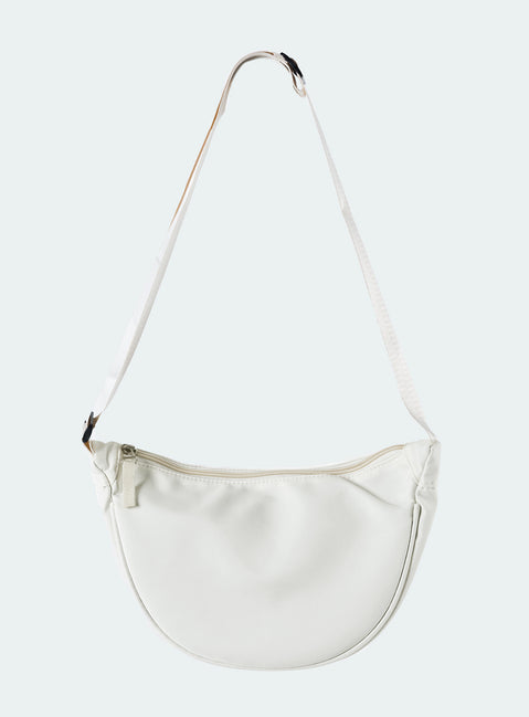White crossbody bag Nylon material Adjustable strap Zip fastening Internal slip pocket Silver toned hardware