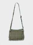 Crossbody bag Adjustable fixed crossbody strap Zip fastenings Two internal pockets Distressed detailing