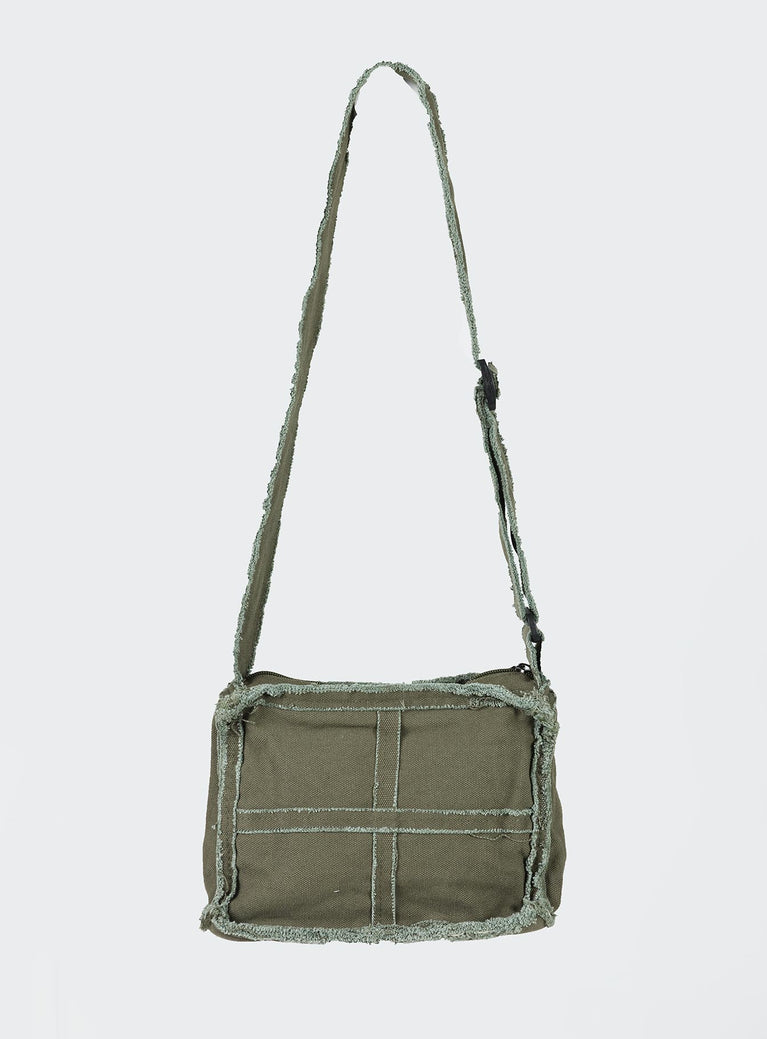 Crossbody bag Adjustable fixed crossbody strap Zip fastenings Two internal pockets Distressed detailing