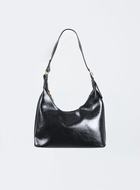 Shoulder bag  90% PU 10% zinc alloy Faux leather material  Adjustable strap  Gold-toned hardware  Zip fastening  Flat base  Internal pocket 