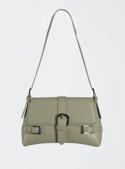 Shoulder bag Faux leather material Adjustable shoulder strap Magnetic button fastening  Buckle detail Silver-toned hardware
