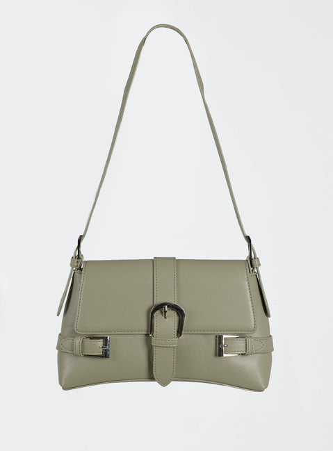 Shoulder bag Faux leather material Adjustable shoulder strap Magnetic button fastening  Buckle detail Silver-toned hardware