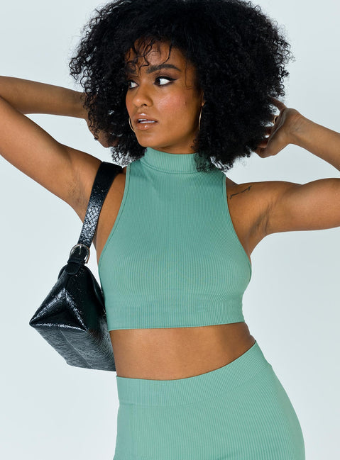 Front view of model wearing  front Princess Polly Sleeveless High Neck  Tarsha Top