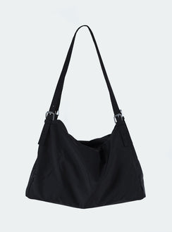 Black bag Canvas material  Silver hardware  Flat base Removable and adjustable straps  Single internal compartment 