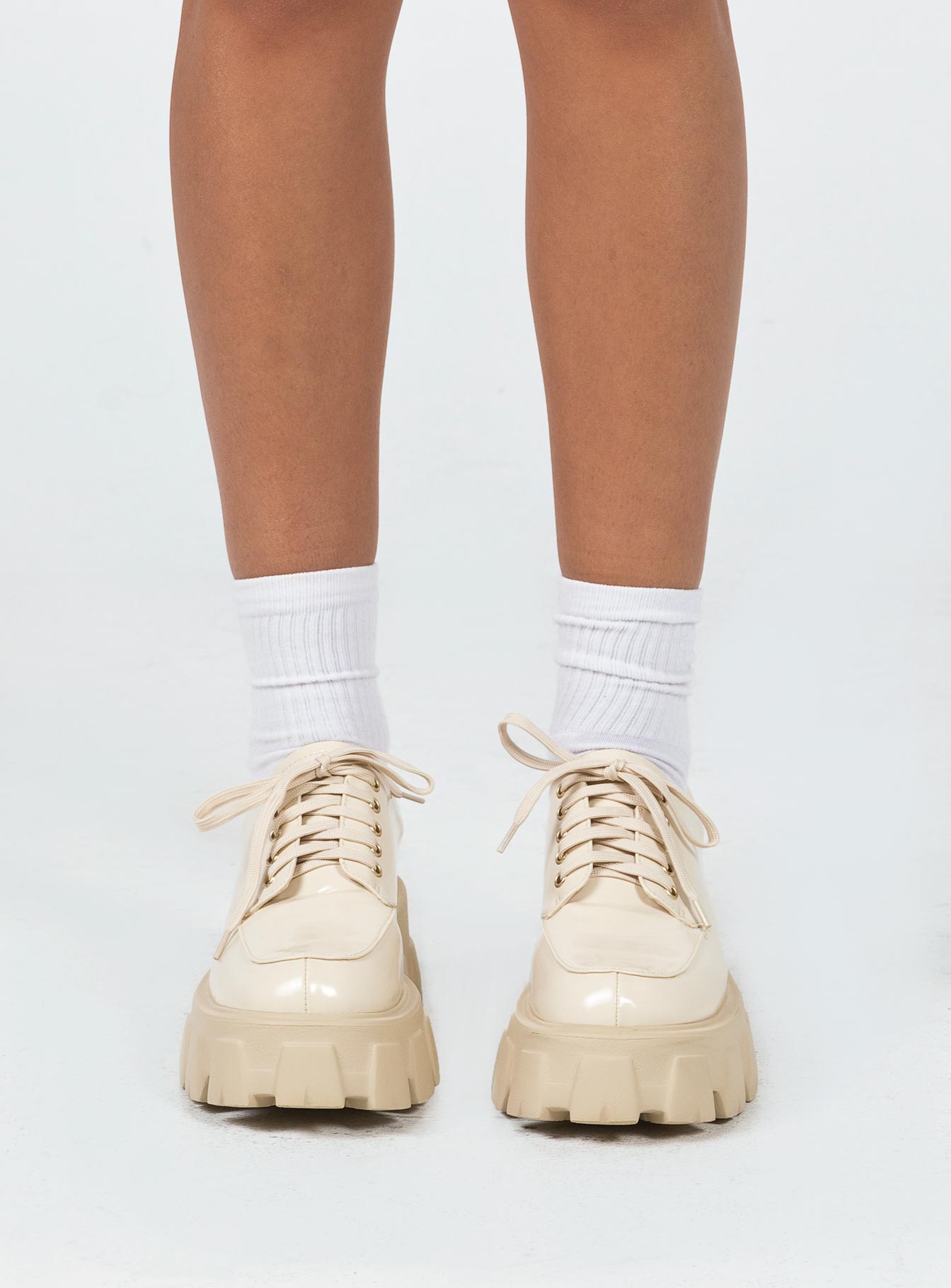 Platform shoes Faux leather Lace up fastening Chunky tread Padded ankle 