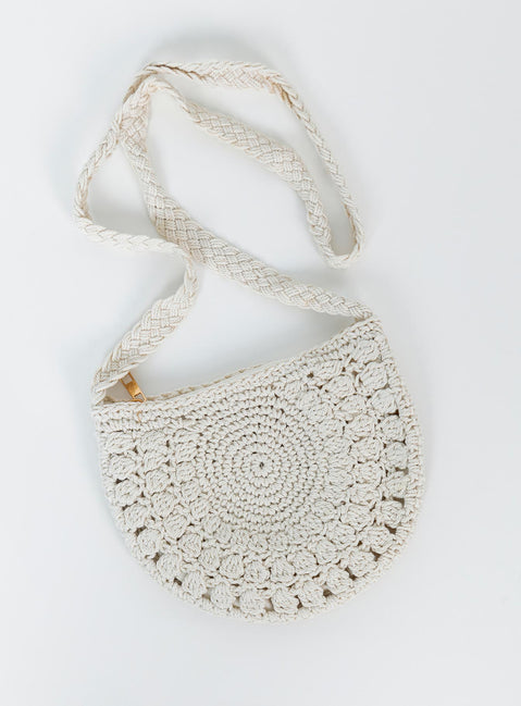 Bag 70% cotton 30% polyester Crochet material  Cross body strap  Rose gold toned hardware  Zip fastening  Single internal pocket  Fully lined 