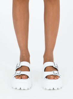 Sandals Faux leather material Platform base Square toe Double strap upper Silver toned buckles Padded footbed Treaded sole