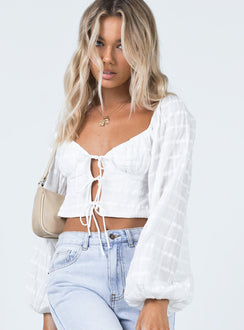 side view of model wearing Princess Polly Riley Long Sleeve Top White 