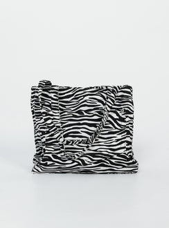 Bag  80% polyester 20% cotton Zebra print  Twin handles External & internal pockets Flat base  Magnetic button fastening 