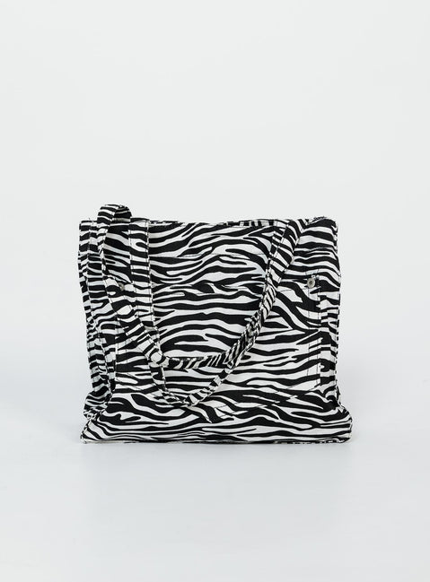 Bag  80% polyester 20% cotton Zebra print  Twin handles External & internal pockets Flat base  Magnetic button fastening 