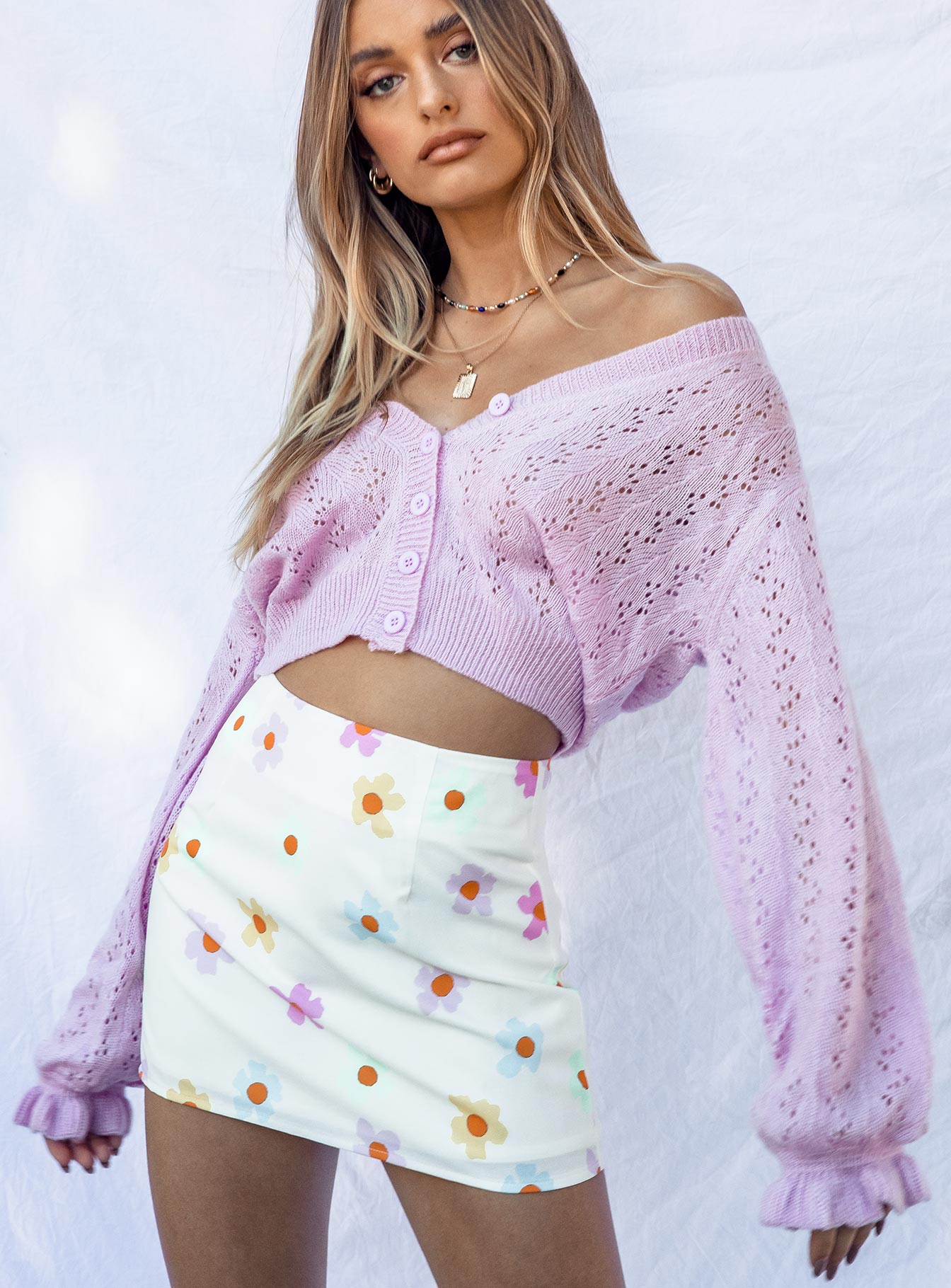   side view of model wearing Princess Polly Mishka Mini Skirt White 