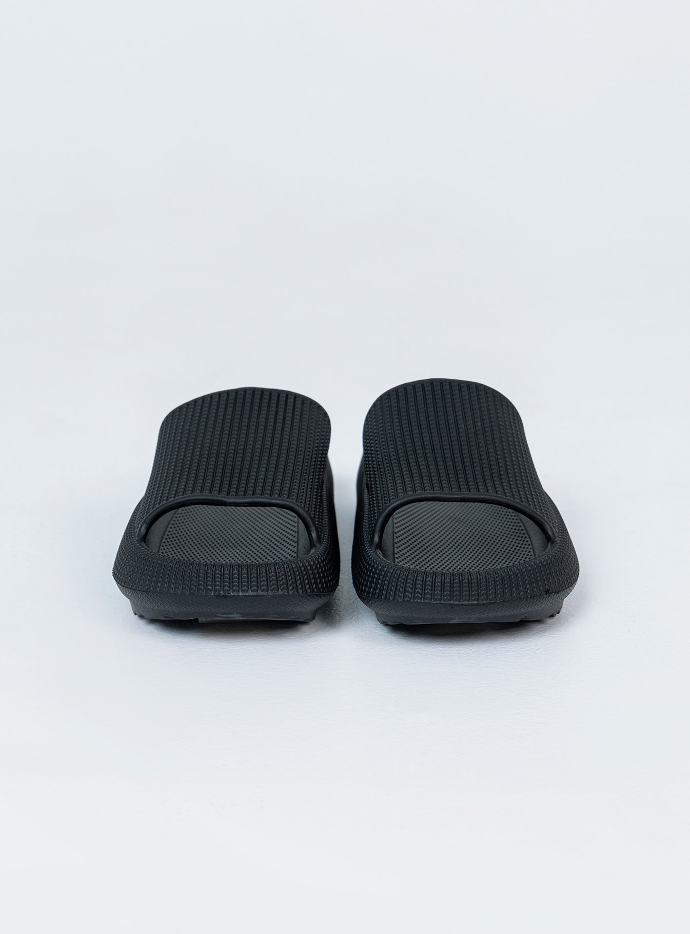 Slides 100% EVA Lightweight rubber  Single wide upper  Rounded toe 