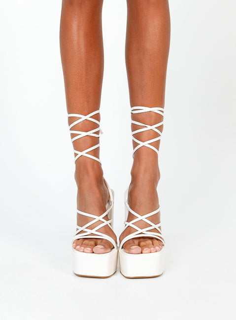 White heels Faux leather material  Strappy upper  Ankle tie fastening  Platform base  Block heel  Square toe 