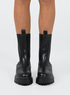 Boots Faux leather material Rounded toe Platform base Ankle pull tab Slip on style