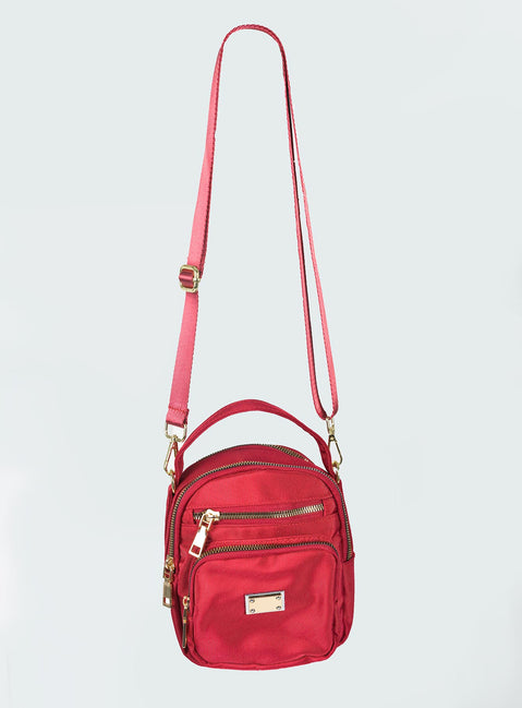 Crossbody bag Nylon material  Single handle  Four seperate compartments Gold-toned hardware Zip fastening Adjustable & removable crossbody strap 