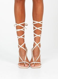 Wedge heels Faux leather material  Strappy upper  Ankle wrap tie fastening Square toe