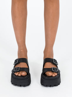 Black Sandals Faux leather material Platform base Square toe Double strap upper Silver toned buckles Padded footbed Treaded sole