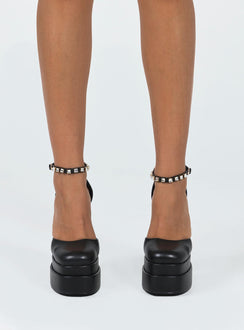 Platform heels Faux leather material  Closed toe  Block heel  Ankle buckle fastening  Platform base 