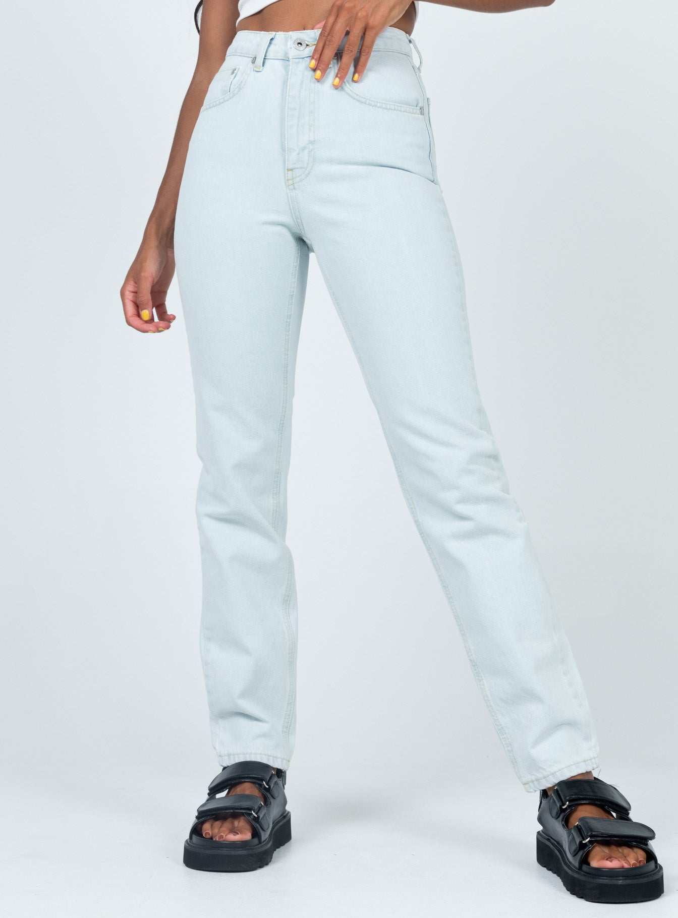 front view of model wearing Princess Polly Ragged Priest Cougar Jeans Stonewash Denim Mid Rise 