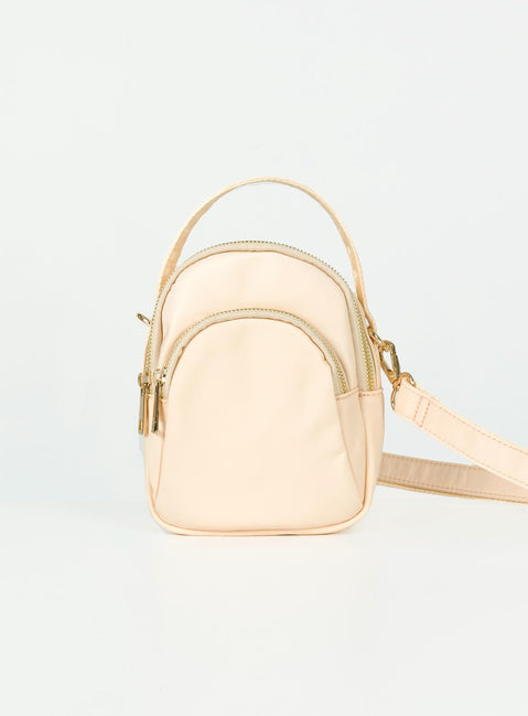 Cream crossbody bag Nylon material Fixed handle Adjustable & removable crossbody strap Three seperate compartments Zip fastenings Gold-toned hardware Flat base