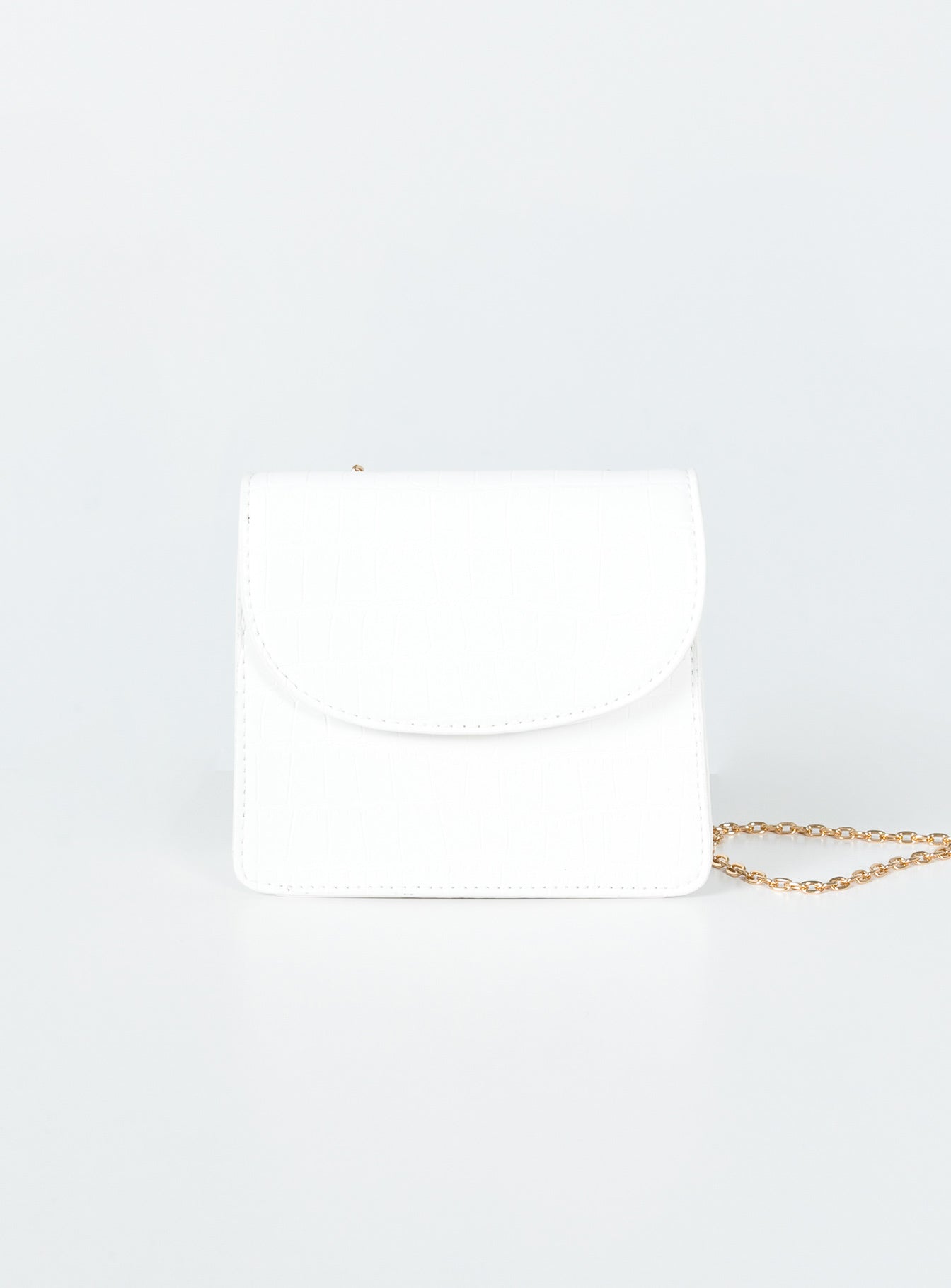 Crossbody bag  Princess Polly Exclusive 100% PU  Faux leather material  Croc print Gold-toned chain strap  Magnetic button fastening  Flat base