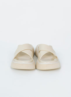 Flats Faux leather material  Cross strap upper  Platform base 