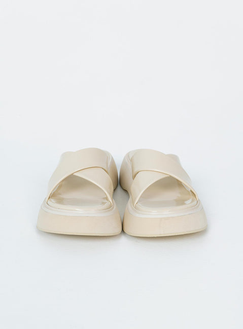 Flats Faux leather material  Cross strap upper  Platform base 