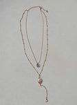 Necklace Pearl detail Drop down charms Lobster clasp fastening Gold-toned