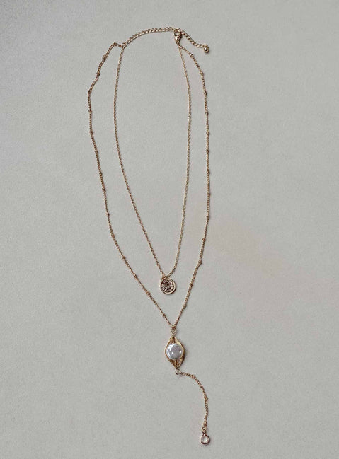 Necklace Pearl detail Drop down charms Lobster clasp fastening Gold-toned