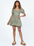 Front view of model wearing  front Princess Polly Square Neck  Ethan Mini Dress Green