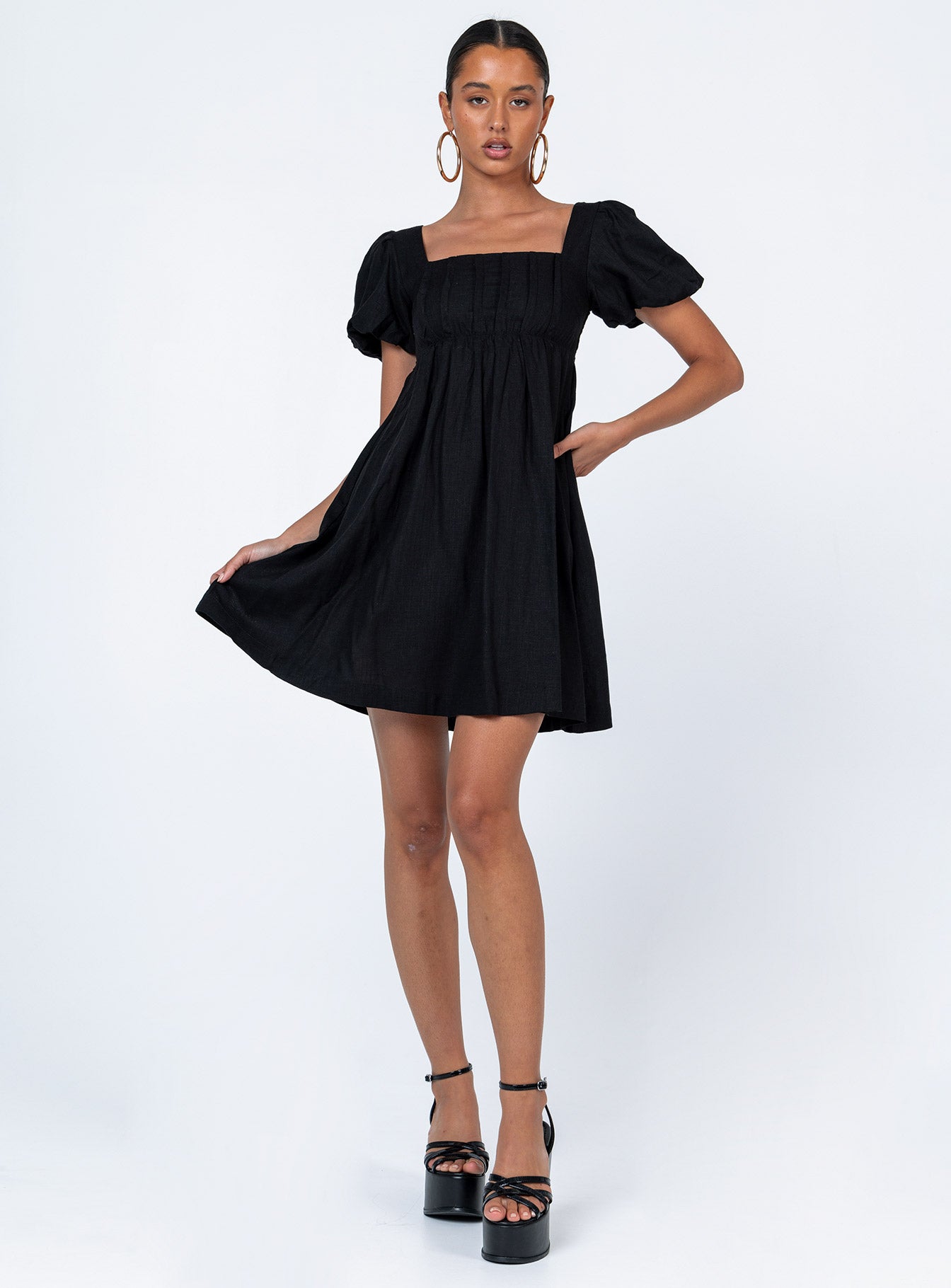 Front view of model wearing  front Princess Polly Asymmetric Neckline  Alondra Mini Dress Black