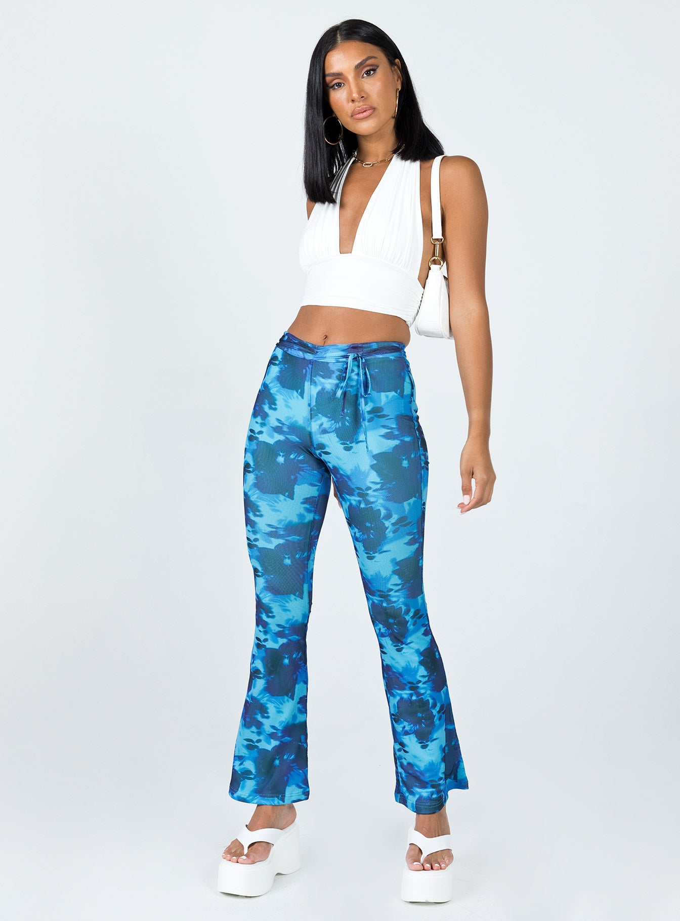 front view of model wearing Princess Polly Allen Floral Flare Pants Blue 