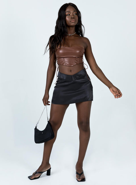 front view of model wearing Princess Polly Maddox PU Strapless Top Brown 