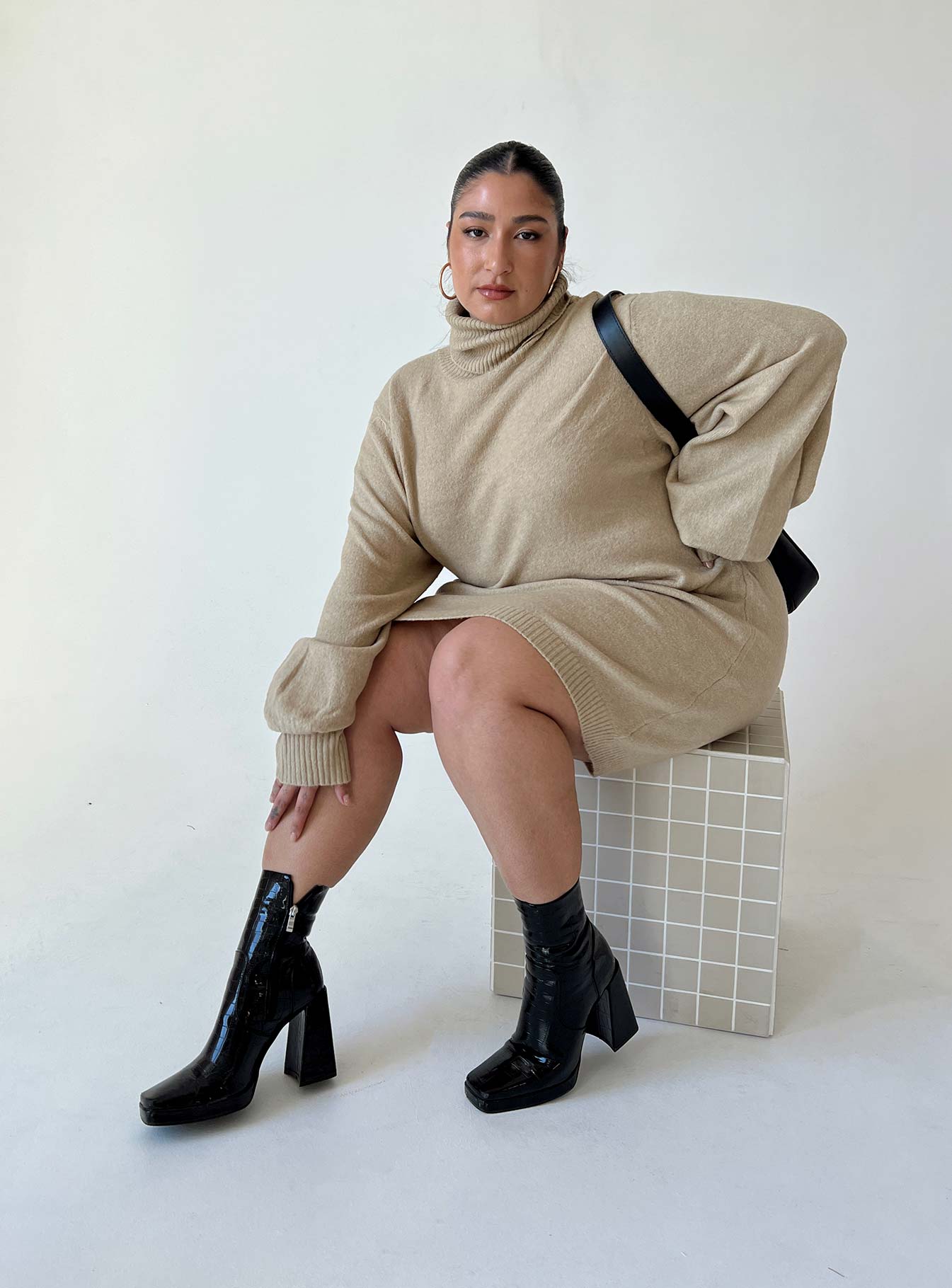 Front view of model wearing  front Princess Polly Asymmetric Neckline  Zahara Mini Dress Beige Curve