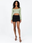 Front view of model wearing  front Princess Polly Short Sleeves High Neck  Linero Top Green