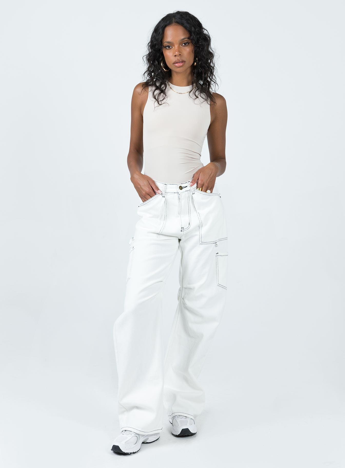 front view of model wearing Princess Polly Fischer Bodysuit Bone Sleeveless High Neck 