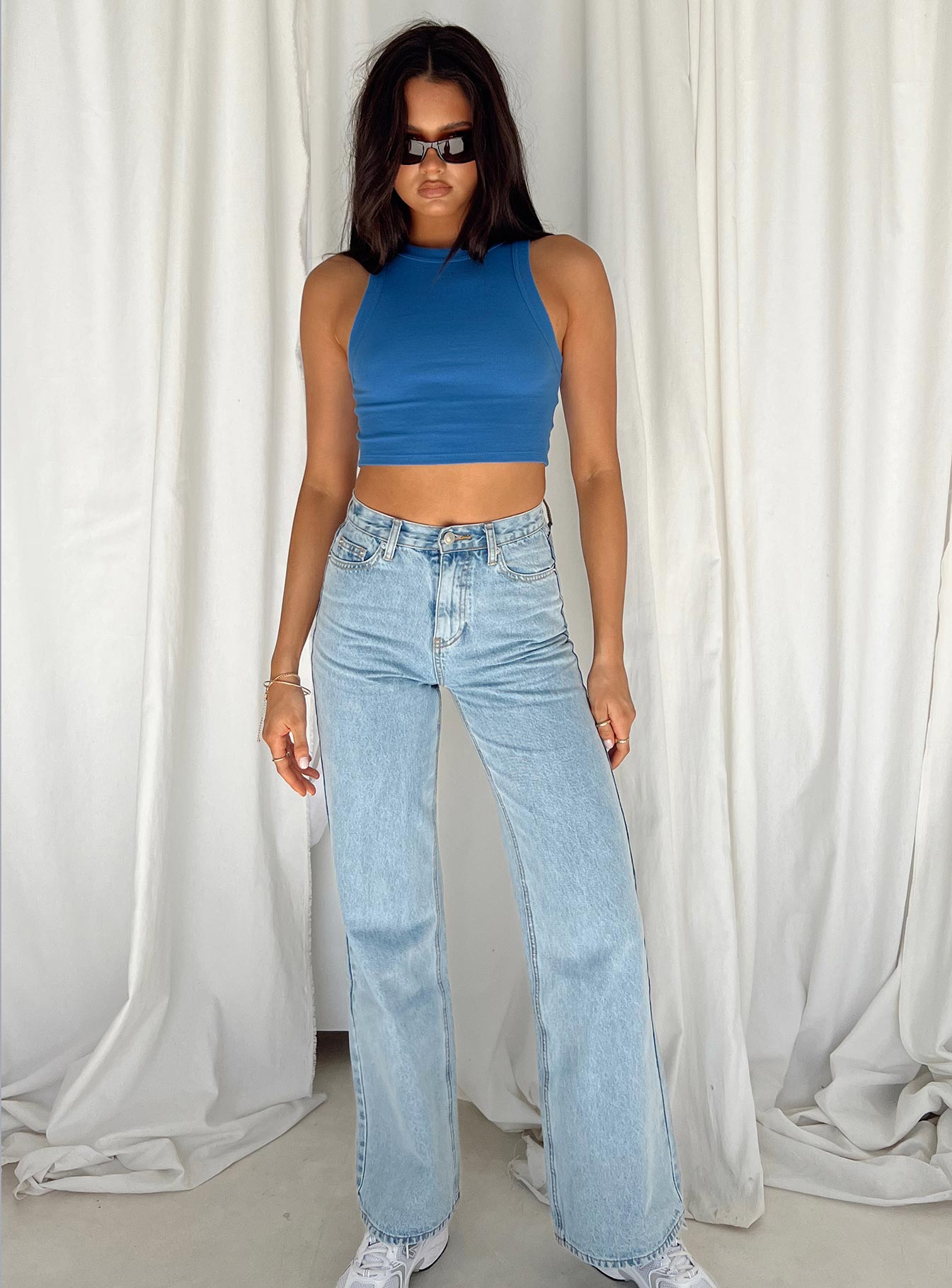 Front view of model wearing  front Princess Polly Sleeveless Square Neck  Classic Tank Top Blue