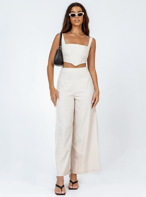 Matching set Silky material  Corset top  Boning through front  Zip fastening at back  High waisted pants  Invisible zip fastening at side  Wide leg 