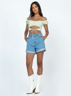 Denim shorts Zip & button fastening  Belt looped waist  Pleated waist  Twin hip pockets  Fixed rolled hem  Branded patch on back 