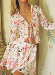 Long sleeve blouse Floral print Classic collar V-neckline Open front design Three-tie fastening at front Slit at cuff