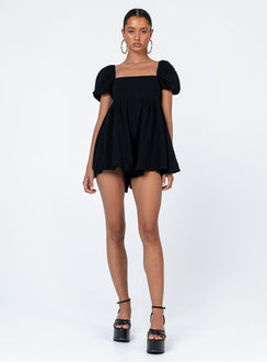 Black romper Muslin look material Square neckline Elasticated puff sleeves Shirred back panel Invisible zip fastening at back Relaxed leg