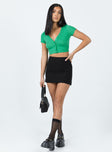 Crop top Ribbed material V-neckline Button fastening at front Lettuce edge hem