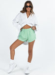 front view of model wearing Princess Polly Beach House Shorts Green Stripe High Waisted Shorts 