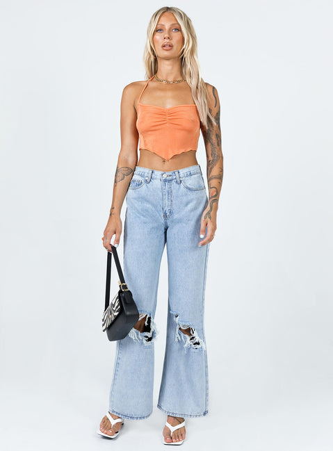 front view of model wearing Princess Polly Maple Flare Jeans Knee Rips Light Wash Denim Mid Rise 