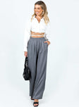 Front view of model wearing  front Princess Polly High Waisted Pants  Higgins Pants Grey Pinstripe