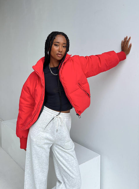 Puffer jacket High neck Zip front fastening Twin zip front pockets Ribbed cuffs Drawstring waist